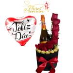 CAJA CILINDRICA DE 8 ROSAS, 8 BOMBONES FERREROS ROCHER, CHAMPAGNE Y GLOBO
